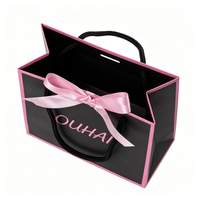 Sac cadeau en papier noir avec bordure rose, poignée en corde de coton, sac fourre-tout personnalisé tendance et élégant pour l'emballage de bijoux et d'accessoires