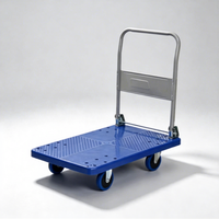 Chariot à plateforme à quatre roues en plastique industriel pour la manutention des matériaux, le stockage et le transport en entrepôt