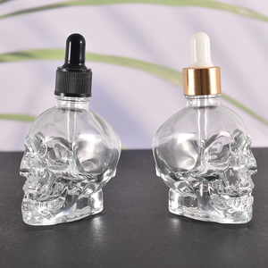 High Quality 50ml 1.5oz Exquisite <strong>Skull</strong> <strong>Glass</strong> <strong>Bottle</strong> With Gold Sliver Dropper for Personal Care - Product Image 1