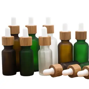 कॉस्मेटिक शेयर 10ml 20ml 30ml 50ml भूरे रंग हरे एम्बर स्किनकेयर आवश्यक तेल की बोतल पाले सेओढ़ लिया स्पष्ट गिलास बांस सीरम की बोतलें