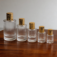 Vente en gros de flacons de parfum transparents à rayures verticales 10ml 30ml 40ml, design luxueux de haute qualité, flacon en verre avec vaporisateur, crème pour la peau, mascara