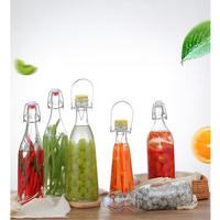 Vente en gros du fabricant Bouteilles d'eau transparentes de 750ml 1000ml à couvercle rabattable avec bouchon hermétique
