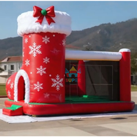 Château gonflable de Noël personnalisable avec toboggan pour fêtes et locations d'attractions en centre commercial