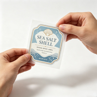 Étiquettes personnalisées en rouleau bleu clair avec feuille d'or, autocollants coquillage et sel marin pour l'emballage des pots d'assaisonnements de fruits de mer, impression