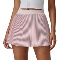 Jupe de tennis plissée pour femme avec taille élastique et short intégré, design mini sportif bleu clair pour toutes les saisons