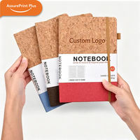 Carnet A5 multicolores en liège écologique avec logo personnalisé, couverture en tissu durable, pages lignées et élastique
