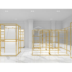 Décoration de magasin de vêtements haut de gamme présentoir de vêtements en or personnalisé fourni conception de magasin de vêtements complète - Product Image 4