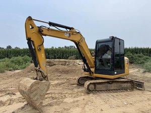 Mini-excavatrice sur chenilles CAT 306E2 de 1,5 tonne avec godet de creusement d'une capacité de 0,12 m³, moteur d'origine, utilisée pour la construction et l'aménagement paysager - Product Image 1