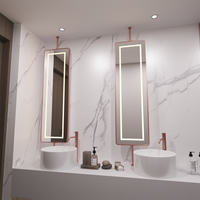 Meuble-lavabo double mural en bois de noyer foncé avec vasques à poser, miroir LED à cadre doré, robinets chromés, style moderne