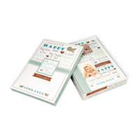 Livre de souvenirs pour bébé avec couverture rigide et papier offset dans une boîte à souvenirs