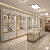 Vitrine à bijoux de luxe finition miroir dorée, étagères en verre réglables, éclairage LED, écologique, robuste, haut de gamme, boutique