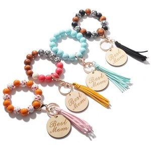 Pulsera de cuentas de madera de leopardo, llavero de cuerda elástica, borla tallada a mano, llavero de pulsera de disco - Product Image 1