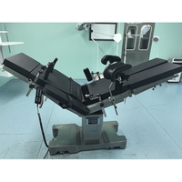 Table d'opération chirurgicale électrique six fonctions compatible radiographie avec système de contrôle double et fonction de translation longitudinale