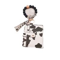 Portefeuille à bracelet en perles de silicone, porte-cartes, porte-clés en cuir PU, porte-clés à pompon, porte-monnaie pour femme, porte-clés à bracelet