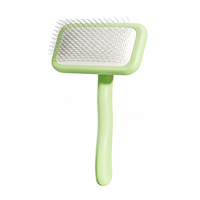Brosse professionnelle pour animaux de compagnie avec caoutchouc ABS et aiguilles en acier inoxydable pour un démêlage en profondeur et l'élimination des poils chez les chiens et les chats