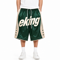Shorts de basketball capri amples 3/4 style streetwear athlétique avec bordure contrastante et logo graphique imprimé par sublimation personnalisé