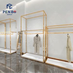 Exhibidores de Ropa de Alta Gama Personalizados para Tiendas de Zapatos, Bolsos y Ropa, Diseño Interior Dorado, Estantes para Exhibición de Vestidos de Mujer - Product Image 5