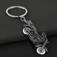 Porte-clés mousqueton moto de simulation cool en alliage de zinc, design roue rotative, résistant aux UV et à l'eau, pendentif de sac automobile, nouveauté, vente en gros