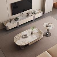 Table basse minimaliste arrondie en pierre frittée beige pour hôtel et maison