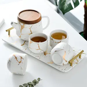 Offre Spéciale luxe moderne théière 4 pièces tasses à thé en céramique grande théière à thé en marbre service avec plateau en bois