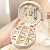 Vente en gros emballage de bijoux boucles d'oreilles bagues colliers boîtes à bijoux de voyage, boîtes de rangement de bijoux portables rondes en cuir PU