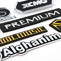 Oem/odm Autocollants personnalisés de logo d'emblème d'ABS résistant à la corrosion de résistance aux chocs de galvanoplastie avec auto-adhésif
