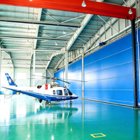 Porte de hangar en tissu robuste avec système de levage vertical pliable pour les installations de stockage et d'entretien d'avions