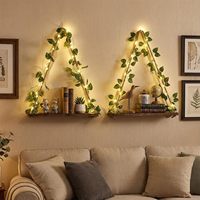 Étagère à plantes tressée en corde de chanvre faite à la main, style bohème, avec guirlande lumineuse à motif de vigne printanière simulée et étagère de rangement lumineuse