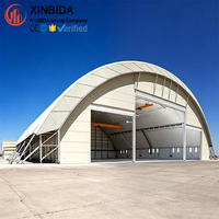 Hangar préfabriqué en acier à grande portée pour le stationnement d'avions, atelier, structure stable, installation rapide sur site