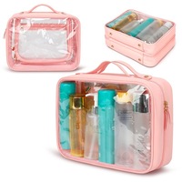 Sac de voyage cosmétique imperméable en PVC transparent à double pliage avec poignée de transport en PU et plusieurs poches zippées