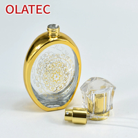 Nouveau flacon de parfum en verre de style moyen-oriental, plaqué or, atomiseur sculpté de manière complexe ; flacon d'huile essentielle avec vaporisateur
