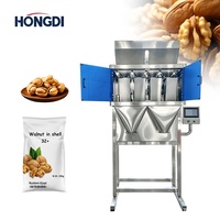 Machine de remplissage automatique à quatre têtes linéaires pour granulés, noix, graines et aliments