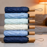 Parapluie de voyage pliable en 3 sections avec poignée en bois de couleur unie de haute qualité, personnalisable avec logo, vente en gros