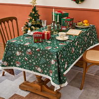Nappe de Noël en jacquard, base verte avec motif Père Noël et bonhomme de neige, nappe à franges, protection de table saisonnière pour les dîners de fêtes
