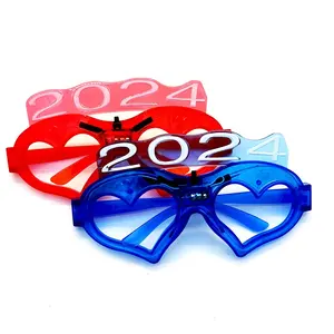 Lunettes LED en plastique pour enfants 2024 Lunettes de soleil clignotantes pour le Nouvel An Fête de Noël Bar Fournitures Light Up 2024 Lunettes de fête