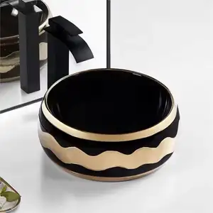 CaCa vendita calda Design speciale oro e nero da banco in ceramica lavello di piccole dimensioni