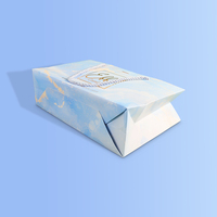 Sac de shopping en papier cartonné blanc de luxe réutilisable avec logo personnalisé, poignée en ruban et lamination