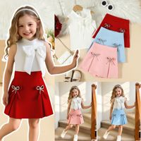 Ensemble 2 pièces d'été pour filles : Haut uni sans manches avec nœud et jupe-short à strass – Tenue pour enfants