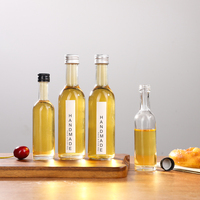 Bouteille en verre mini haute transparence de 50 ml et 100 ml avec étiquette personnalisée et bouchon en aluminium, conçue pour la bière, le brandy, les boissons énergisantes et le vin