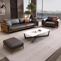 Canapé de bureau modulable trois places en cuir véritable moderne, combinaison table basse pour appartement commercial