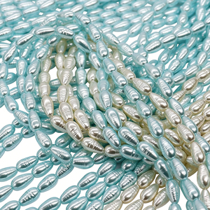 Cuentas de vidrio premium con núcleo pesado, forma Petite Marquise, color Azul Glaciar y Blanco Marfil, con textura de hilo, para DIY estilo Mermaidcore - Product Image 1