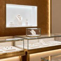 Vitrine d'îlot de luxe en métal pour bijoux, avec éclairage LED et tiroirs de rangement, idéale pour la présentation de montres et de diamants en boutique