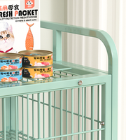 Cage à chat multi-niveaux en métal vert avec roulettes et espace de rangement, villa intérieure pour chats