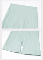 Ensemble de sport pour femme : Short de gym taille haute en nylon avec poches et soutien-gorge à bretelles croisées, idéal pour le yoga, couleur unie, vente en gros, personnalisable, pour l'entraînement
