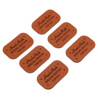Étiquette en cuir personnalisée en gros, patch en cuir avec logo en relief pour accessoires vestimentaires