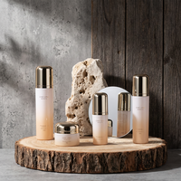 Ensemble d'emballages cosmétiques cylindriques écologiques recyclables OEM/ODM, flacon en verre rose givré vide avec logo personnalisé