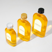 Bouteilles en verre transparentes plates en gros, prêtes à être expédiées, pour l'emballage de vin, de jus, de café et de boissons, avec bouchons