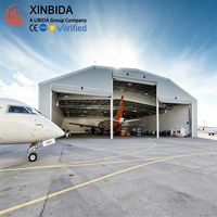 Hangar préfabriqué en acier à grande portée pour le stockage et la révision d'avions, résistant aux vents forts et à la neige, installation rapide sur site