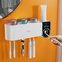 Stérilisateur UV intelligent pour brosses à dents, nouveau support mural sans perçage, ensemble de lavage, porte-brosse à dents en plastique avec distributeur de dentifrice électrique