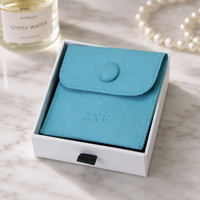 Pochette à bijoux en microfibre de velours bleu lac de luxe personnalisée ZXF de haute qualité avec bouton et insert logo